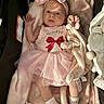 baby, infant, pink_clothing, headband, bow, plush_toy, blanket, sock, tutu, onesie, lying_down, soft_toy, cute, indoors, child, newborn, person, baby_girl, resting, portrait