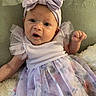 Ava is registered to the contest to win money with this photo: baby, child, infant, dress, headband, bow, purple, floral, tulle, cute, portrait, indoor, fabric, clothing, person, young, skin, face, hand, expression