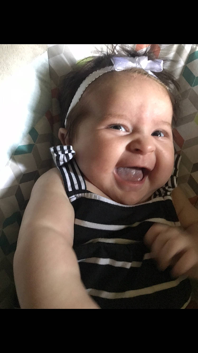 Aniston is registered to the contest to win money with this photo: baby, cheek, child, chin, ear, eyebrow, face, facial_expression, forehead, fun, hair_accessory, happy, head, headgear, laugh, lip, nose, person, skin, smile