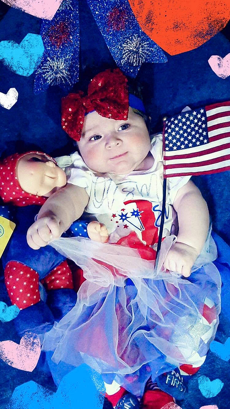 Aniston joined the competition — help win amazing prizes! baby, child, costume, headwear, person, photomontage, product, red, smile, toddler