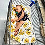 Kingston joined the competition — help win amazing prizes! baby, blanket, shopping_cart, sleeping, pacifier, floor, pet_bed, store, aisle, cushion, child, infant, clothing, comfort, resting, indoor, retail, pattern, cute, soft