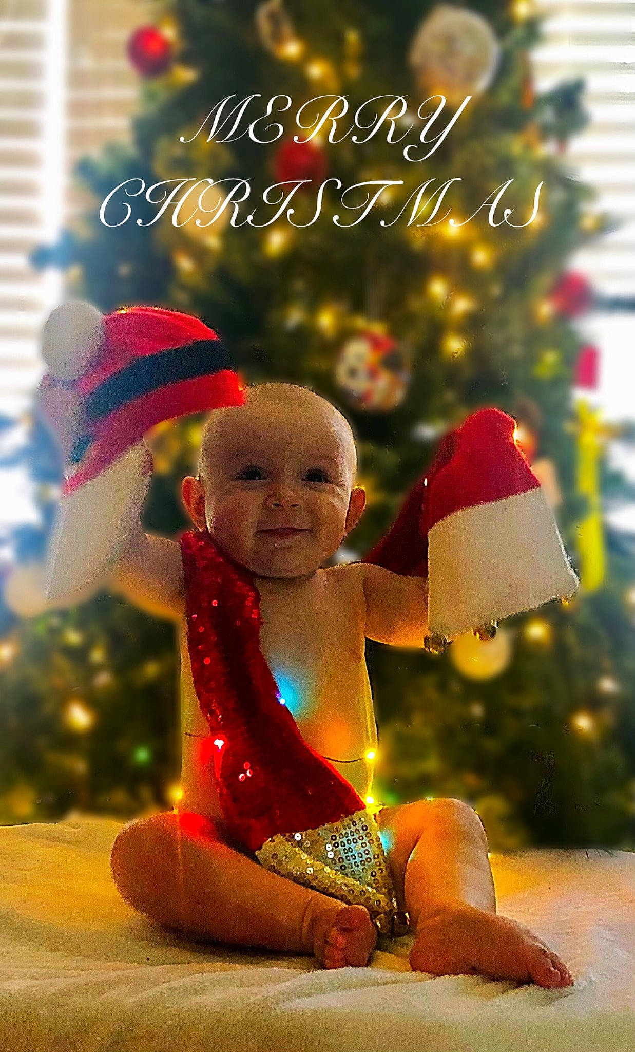Atlan joined the competition — help win amazing prizes! baby, christmas, christmas_decoration, christmas_eve, christmas_ornament, christmas_tree, conifer, event, fictional_character, fun, happy, holiday, holiday_ornament, interior_design, light, ornament, people_in_nature, person, smile, toddler