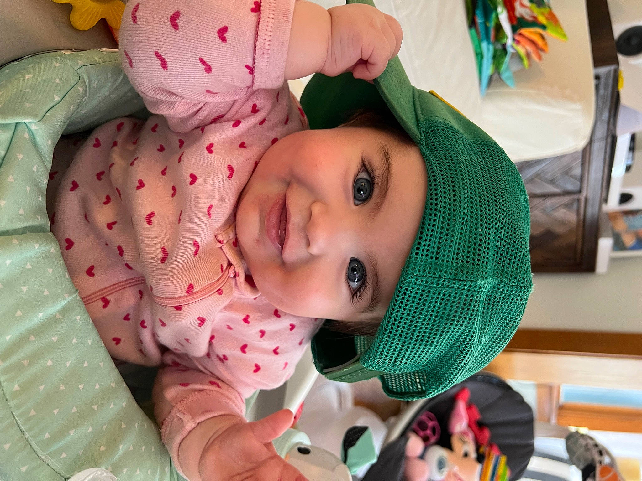 Sloane is registered to the contest to win money with this photo: baby, baby_products, baby_toddler_clothing, child, comfort, eye, eyelash, fun, happy, head, headwear, joy, lip, mouth, nose, pattern, person, pink, skin, smile