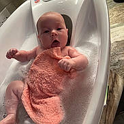 Blakely is registered to the contest to win money with this photo: baby, baby_bath, bath_time, bathroom, bathtub, bubbles, countertop, cute, expression, foam, hands, infant, legs, marble, newborn, portrait, skin, towel, washcloth, water