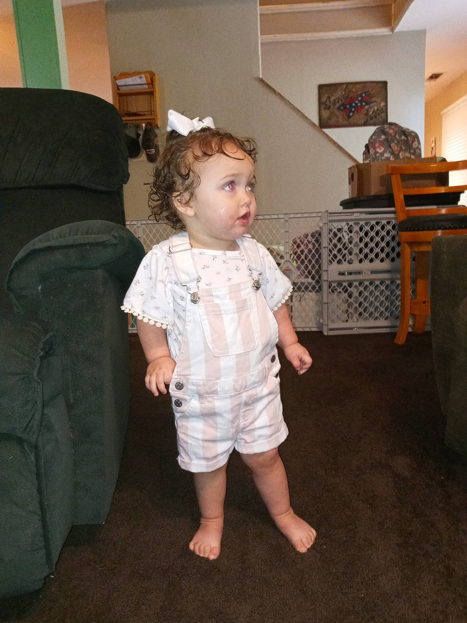 Elainakaye joined the competition — help win amazing prizes! baby, baby_toddler_clothing, chair, child, comfort, couch, floor, flooring, foot, fun, furniture, head, lamp, living_room, person, picture_frame, room, sleeve, standing, surprise