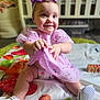 baby, infant, child, smiling, purple_dress, headband, play_mat, toy_blocks, crib, nursery, floor, sitting, cute, happy, indoor, young_child, footwear, clothing, person, portrait
