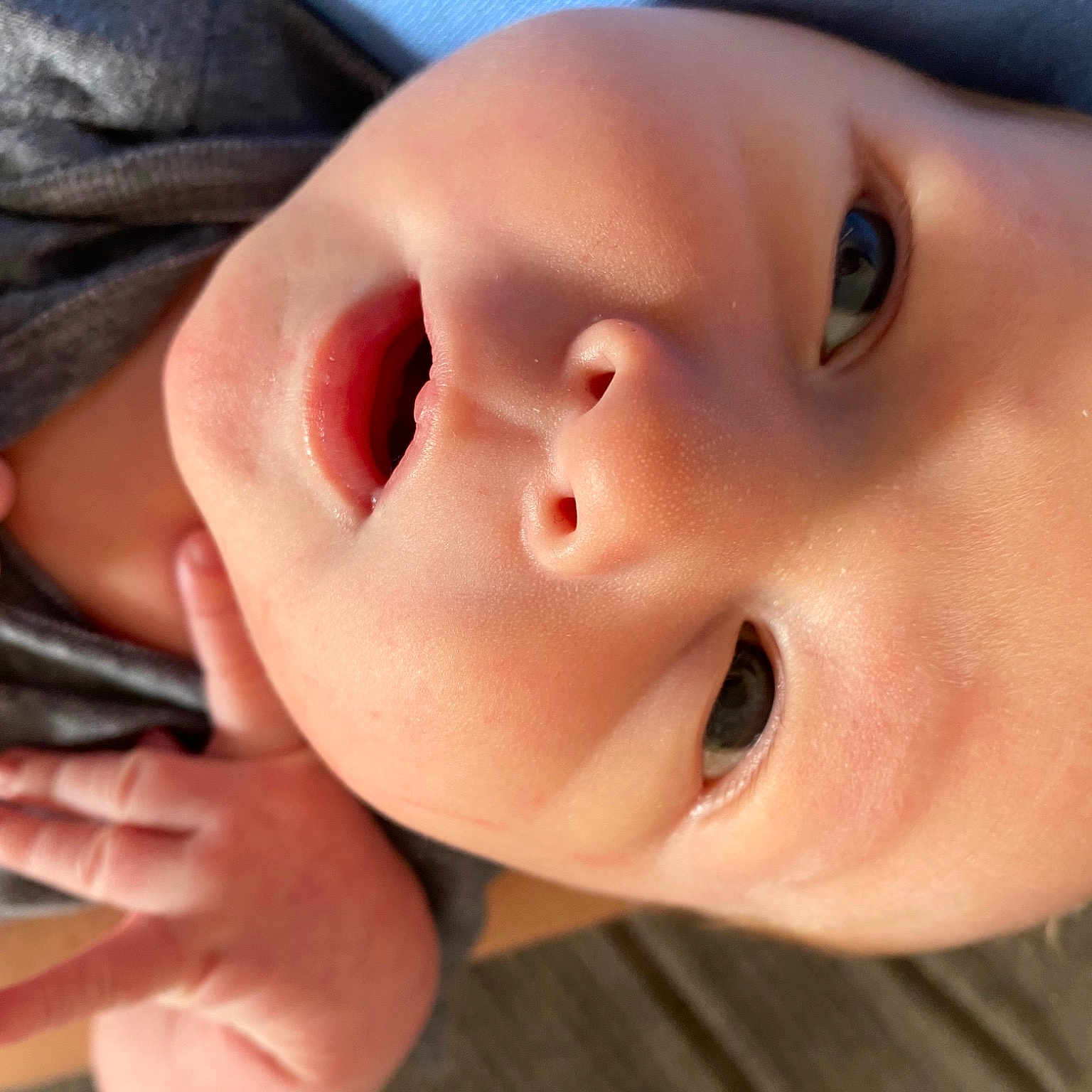 Chase is registered to the contest to win money with this photo: baby, cheek, child, eyebrow, eyelash, facial_expression, finger, gesture, iris, lip, mouth, nail, neck, nose, skin, smile, tableware, thumb, toddler, vertebrate