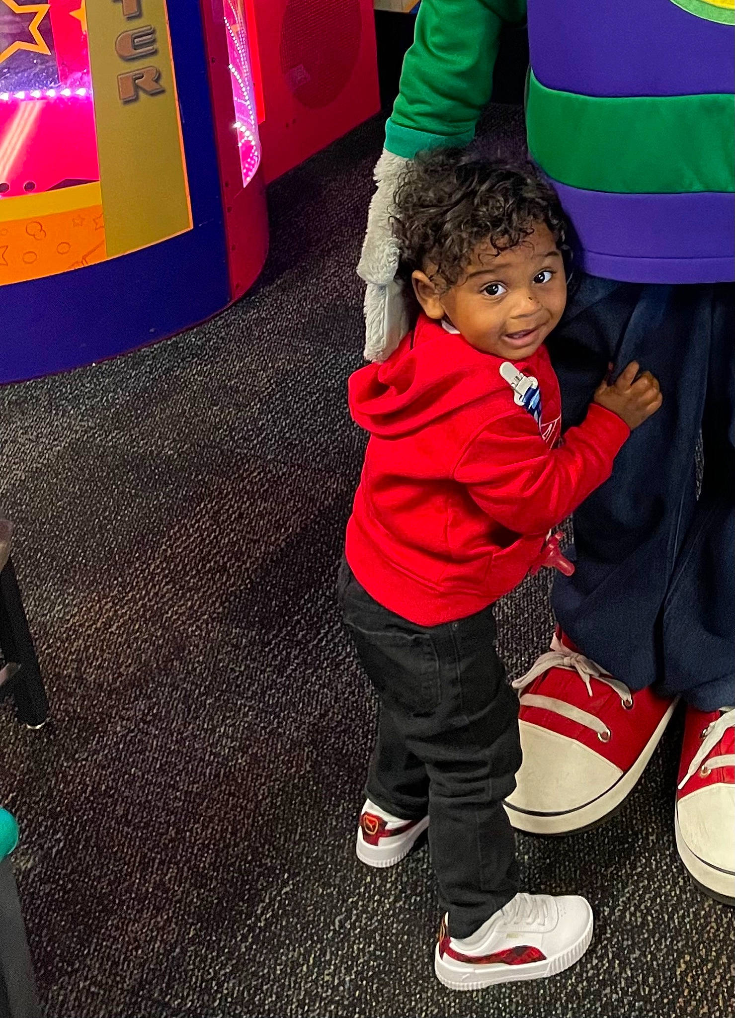 Princeton is registered to the contest to win money with this photo: child, cool, electric_blue, event, fashion, flooring, fun, happy, human_leg, jacket, leisure, magenta, person, pink, plant, recreation, red, snapshot, sock, toddler