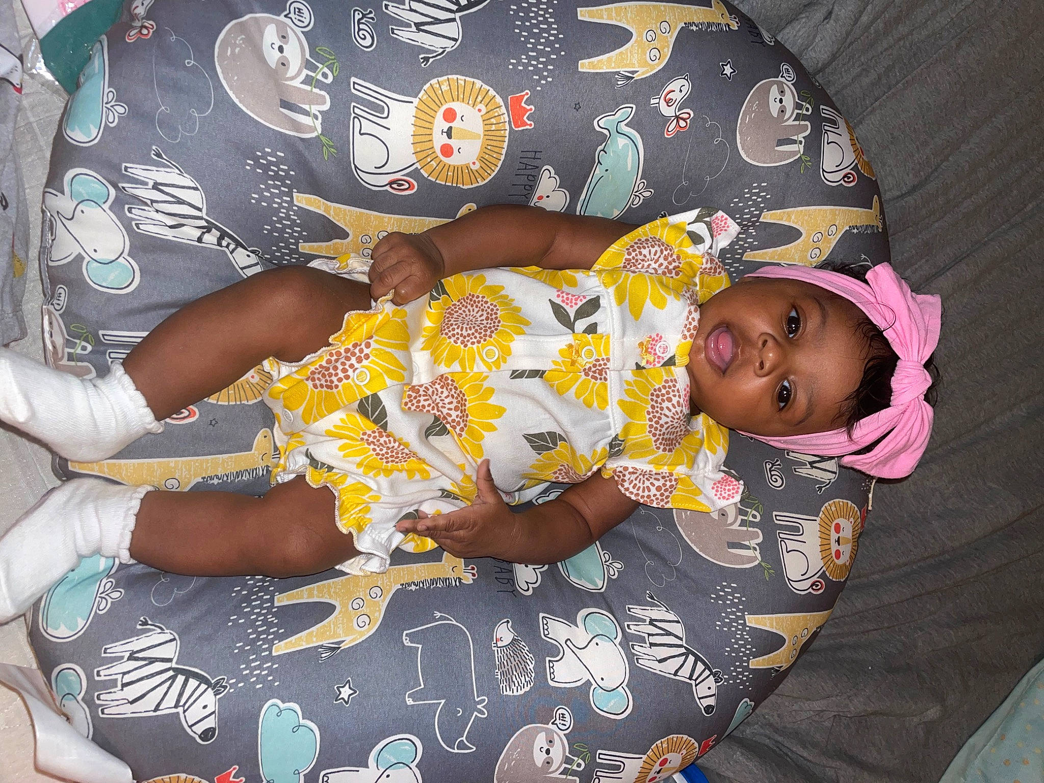 Egypt is registered to the contest to win money with this photo: arm, baby_toddler_clothing, child, comfort, cool, finger, fun, hand, happy, headwear, human_body, lap, leg, pattern, people, person, product, sleeve, t_shirt, textile