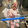 Kay Michelle is registered to the contest to win money with this photo: aisle, baby, baby_girl, blanket, clothing_rack, cute, floor, flower, headband, indoor, man, person, pink_clothing, retail, shopping, shopping_cart, shopping_trip, slippers, socks, store