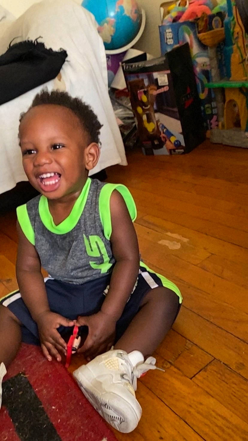 Elijah joined the competition — help win amazing prizes! child, flooring, foot, fun, happy, hardwood, head, human_leg, joy, leisure, person, room, sandal, shorts, sitting, skin, smile, t_shirt, thigh, toddler