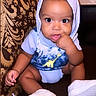 Kassio joined the competition — help win amazing prizes! baby, child, hoodie, blue_shirt, white_shoes, sitting, finger_in_mouth, curious, indoor, couch, patterned_fabric, closeup, cute, infant, portrait, young_child, clothing, face, person, toddler