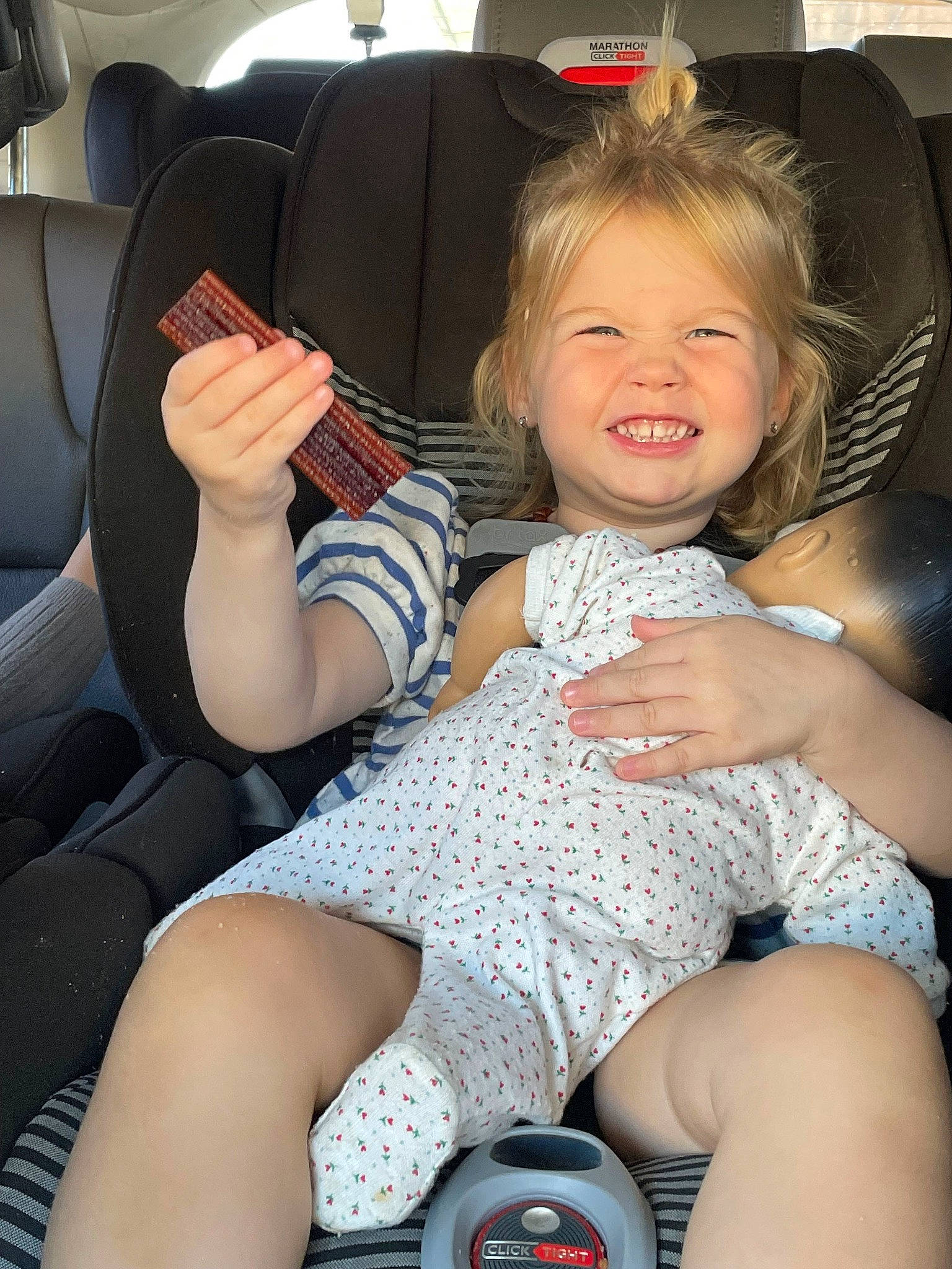 Alyssa joined the competition — help win amazing prizes! blond, car_seat, car_seat_cover, child, comfort, fun, happy, head_restraint, human_leg, knee, lap, leg, leisure, nail, person, sitting, skin, smile, thigh, thumb