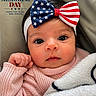 baby, blanket, bow, child, closeup, cozy, cute, face, headband, holiday_message, indoors, infant, memorial_day, newborn, patriotic, pink_sweater, portrait, red_white_blue, stars, stripes