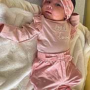 Leilani Levina joined the competition — help win amazing prizes! baby, infant, newborn, headband, bow, pink_clothing, onesie, socks, blanket, pacifier, lying_down, portrait, cozy, cute, soft_texture, bed, nursery, eyes_open, baby_feet, smiling_socks