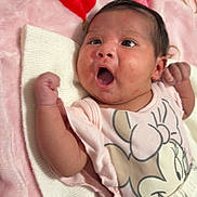Leilani Levina is registered to the contest to win money with this photo: baby, infant, newborn, face, eyes, surprised_expression, open_mouth, arm, fist, pink_blanket, red_heart, minnie_mouse, onesie, clothing, portrait, lying_down, soft_texture, cute, skin_spots, newborn_clothing