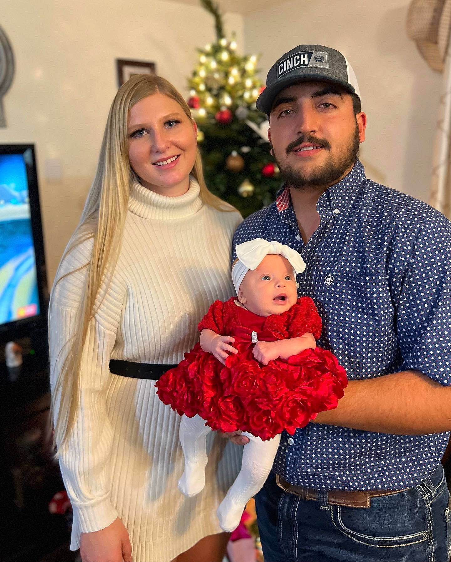 Adalyna is registered to the contest to win money with this photo: baby, beard, belt, child, christmas, event, facial_expression, fictional_character, fun, happy, hat, headwear, holiday, jewellery, joy, lap, ornament, person, red, santa_claus