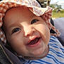 baby, cheerful, child, closeup, cute, daytime, face, gingham, happy, hat, infant, outdoor, person, playground, portrait, seat, smiling, striped_shirt, sun_hat, sunlight