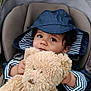 Noa a rejoint le concours — aidez-le/la à gagner de superbes lots ! toddler, child, teddy_bear, stroller, raincoat, hood, striped_clothing, baby_bottle, outdoor, grass, toy, cute, portrait, baby, seat, person, animal_plush, cuddly, young_child, nature