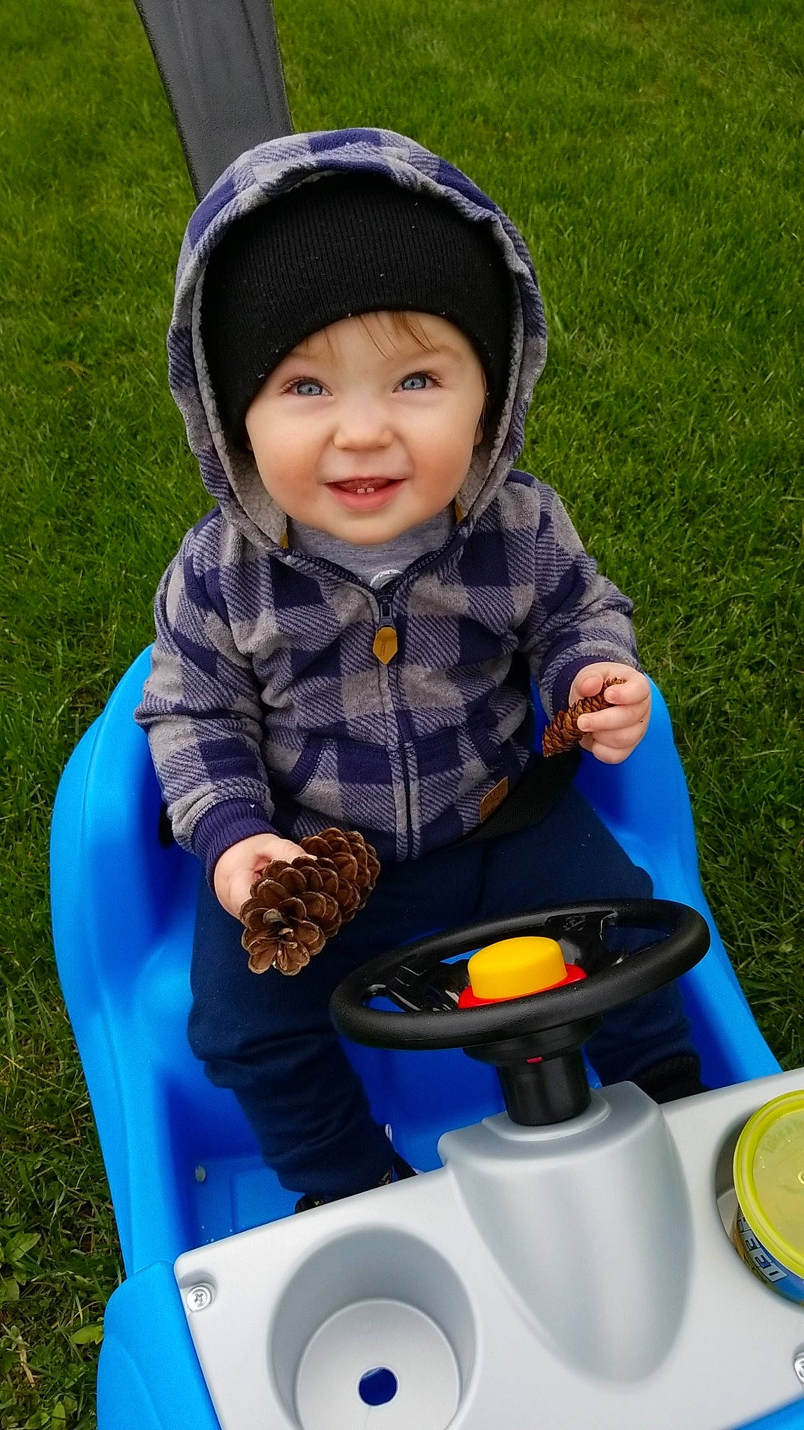 Rogan joined the competition — help win amazing prizes! baby, child, fun, grass, headwear, joy, leisure, person, play, product, sitting, smile, toddler