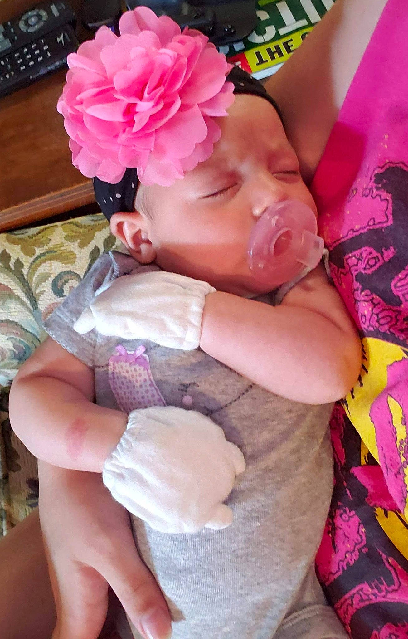 Phoebe is registered to the contest to win money with this photo: baby, child, diaper, flower, headwear, person, petal, pink, plant