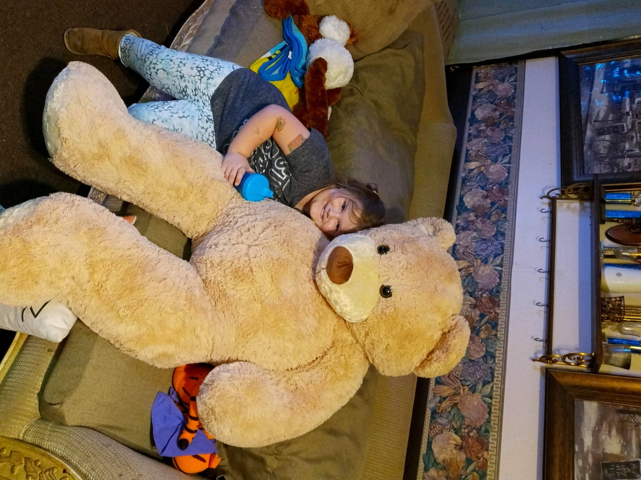 Maleah joined the competition — help win amazing prizes! baby, blue, child, comfort, couch, fun, fur, hat, joy, leisure, mascot, person, picture_frame, plush, room, smile, stuffed_toy, teddy_bear, toddler, toy