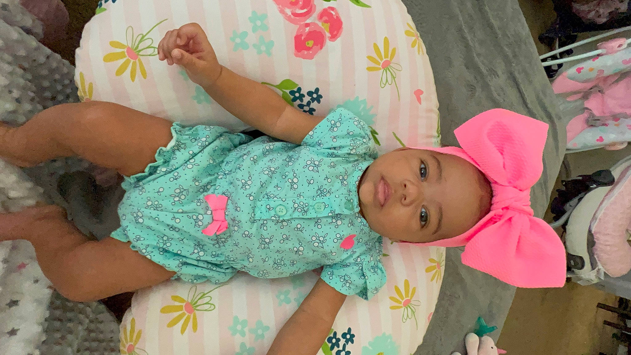 Norii is registered to the contest to win money with this photo: baby, baby_products, baby_toddler_clothing, cheek, child, comfort, elbow, finger, happy, hat, human_body, human_leg, pattern, person, pink, sitting, skin, sleeve, thigh, toddler