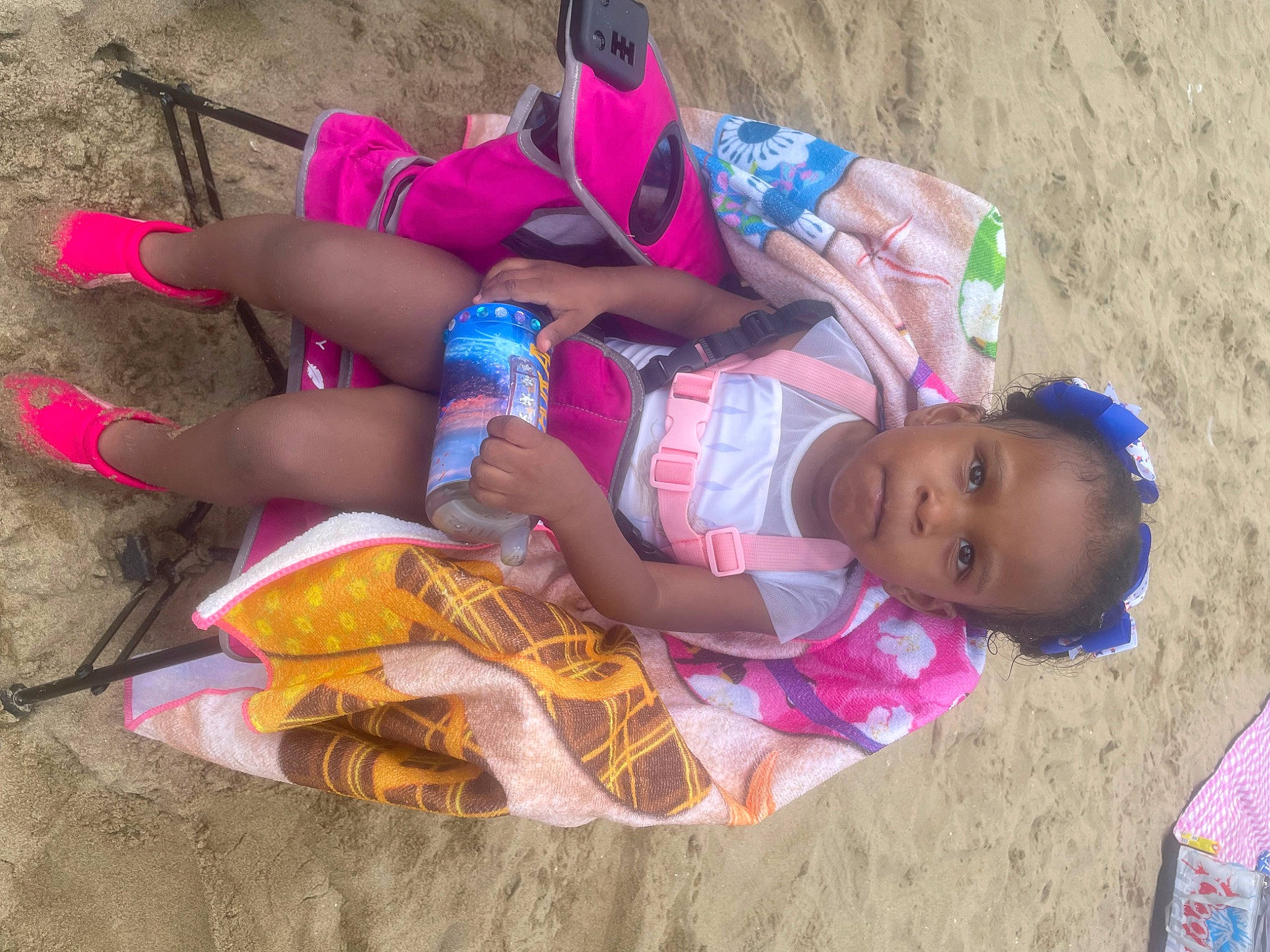 Azara joined the competition — help win amazing prizes! baby, child, foot, fun, happy, human_leg, leisure, magenta, pattern, person, pink, play, recreation, sand, sitting, soil, thigh, toddler, vacation
