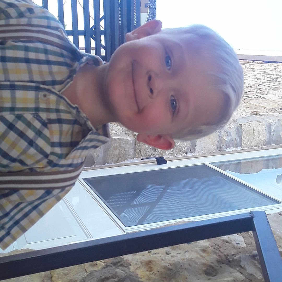 Johnathan is registered to the contest to win money with this photo: architecture, baby, building, computer, electronics, face, furniture, head, laptop, nature, outdoors, person, photography, portrait, rock, shelter, slate, table, tabletcomputer, water