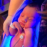 Karri joined the competition — help win amazing prizes! newborn, baby, sleeping, hospital, bassinet, infant, portrait, face, closed_eyes, hands, arm, medical_monitoring, electrodes, hospital_bracelet, blanket, blue_lighting, purple_lighting, peaceful, caregiver, indoor