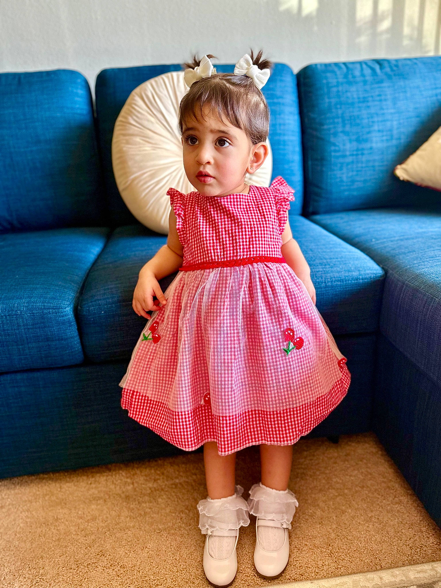 Prisha joined the competition — help win amazing prizes! arm, baby_toddler_clothing, blue, couch, day_dress, dress, eye, finger, hand, human_body, leg, magenta, one_piece_garment, person, pink, shoulder, skin, sleeve, textile, toddler