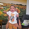 baby, child, infant, smiling, laughing, portrait, held, adult, tshirt, teddy_bear, shorts, shoes, stroller, pillow, sunflower, indoor, home, furniture, happy, photography