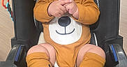 Emiliano joined the competition — help win amazing prizes! adorable, baby, bear_ears, car_seat, child, close_up, happy, infant, laughing, matching_booties, onesie, orange_clothing, outdoor, playful, portrait, seated, smiling, stroller, teddy_bear_costume, toy