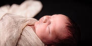 Axel joined the competition — help win amazing prizes! newborn, baby, sleeping, wrapped, cloth, soft, closeup, portrait, infant, peaceful, skin, hair, face, head, rest, calm, cute, child, dark_background, texture