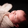 newborn, baby, sleeping, wrapped, cloth, soft, closeup, portrait, infant, peaceful, skin, hair, face, head, rest, calm, cute, child, dark_background, texture