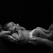 Axel is registered to the contest to win money with this photo: newborn, baby, infant, hands, tattoo, diaper, black_and_white, monochrome, peaceful, sleeping, person, skin, fingers, portrait, closeup, adult, holding, quiet, studio, human