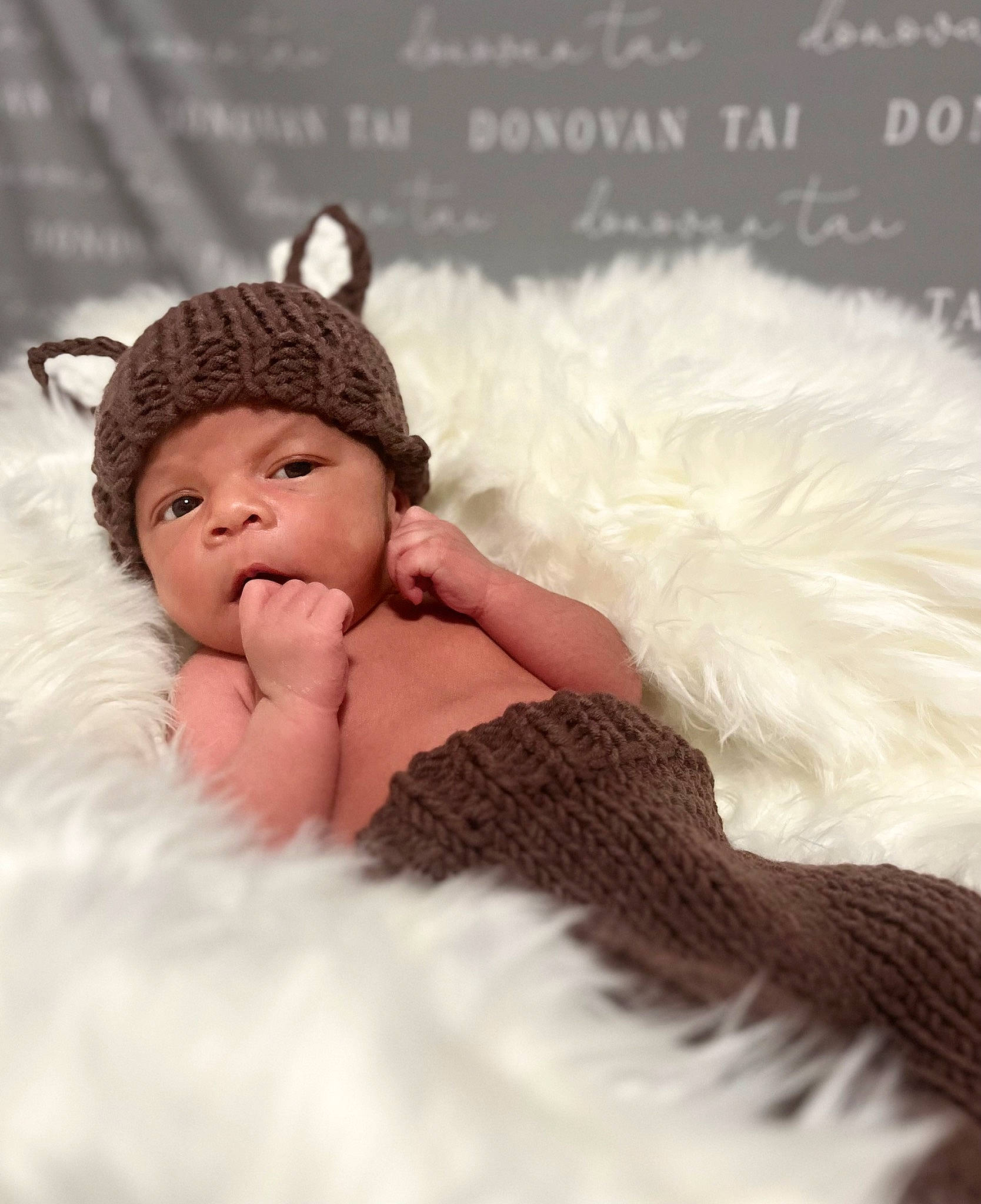 Donovan is registered to the contest to win money with this photo: baby, baby_sleeping, bed, bedding, child, comfort, eyelash, fashion_accessory, flash_photography, fur, hair_accessory, happy, headgear, headpiece, headwear, knit_cap, linens, pattern, person, room