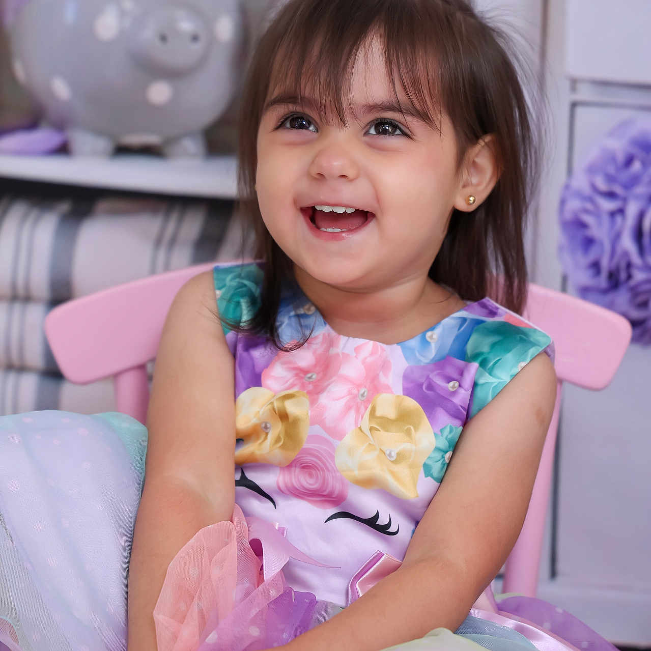 Andrea is registered to the contest to win money with this photo: bodypart, child, clothing, couch, dress, eveningdress, face, female, finger, formalwear, furniture, girl, hand, happy, head, person, photography, portrait, purple, smile