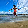 Léana participe au concours pour gagner de l'argent avec cette photo : child, beach, jumping, sand, water, sky, clouds, ocean, waves, swimsuit, summer, shore, vacation, play, outdoor, fun, holiday, sunny, leisure, coast