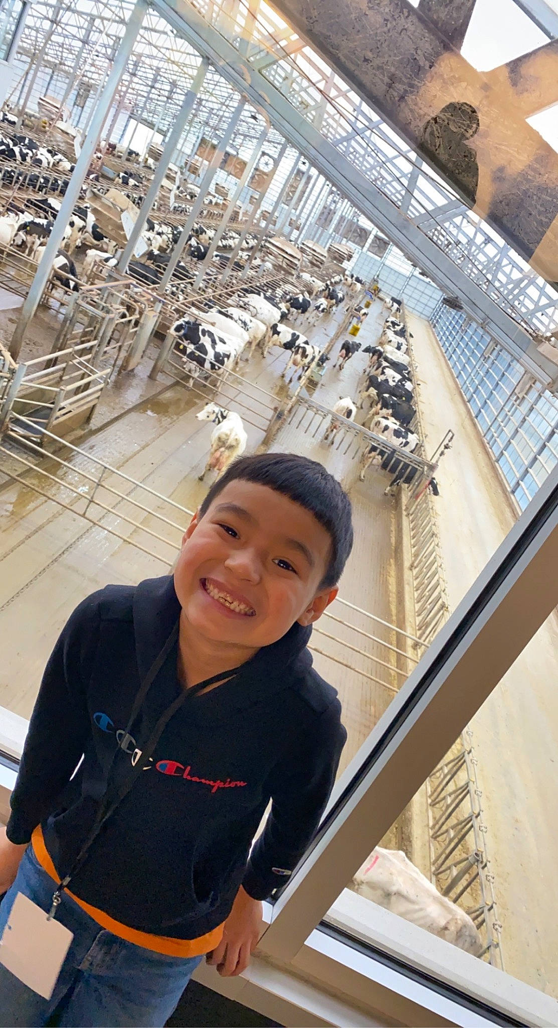 Elijah is registered to the contest to win money with this photo: building, daylighting, engineering, fun, happy, joy, leisure, metal, person, photograph, photography, recreation, sleeve, smile, snapshot, steel, t_shirt, toddler, travel