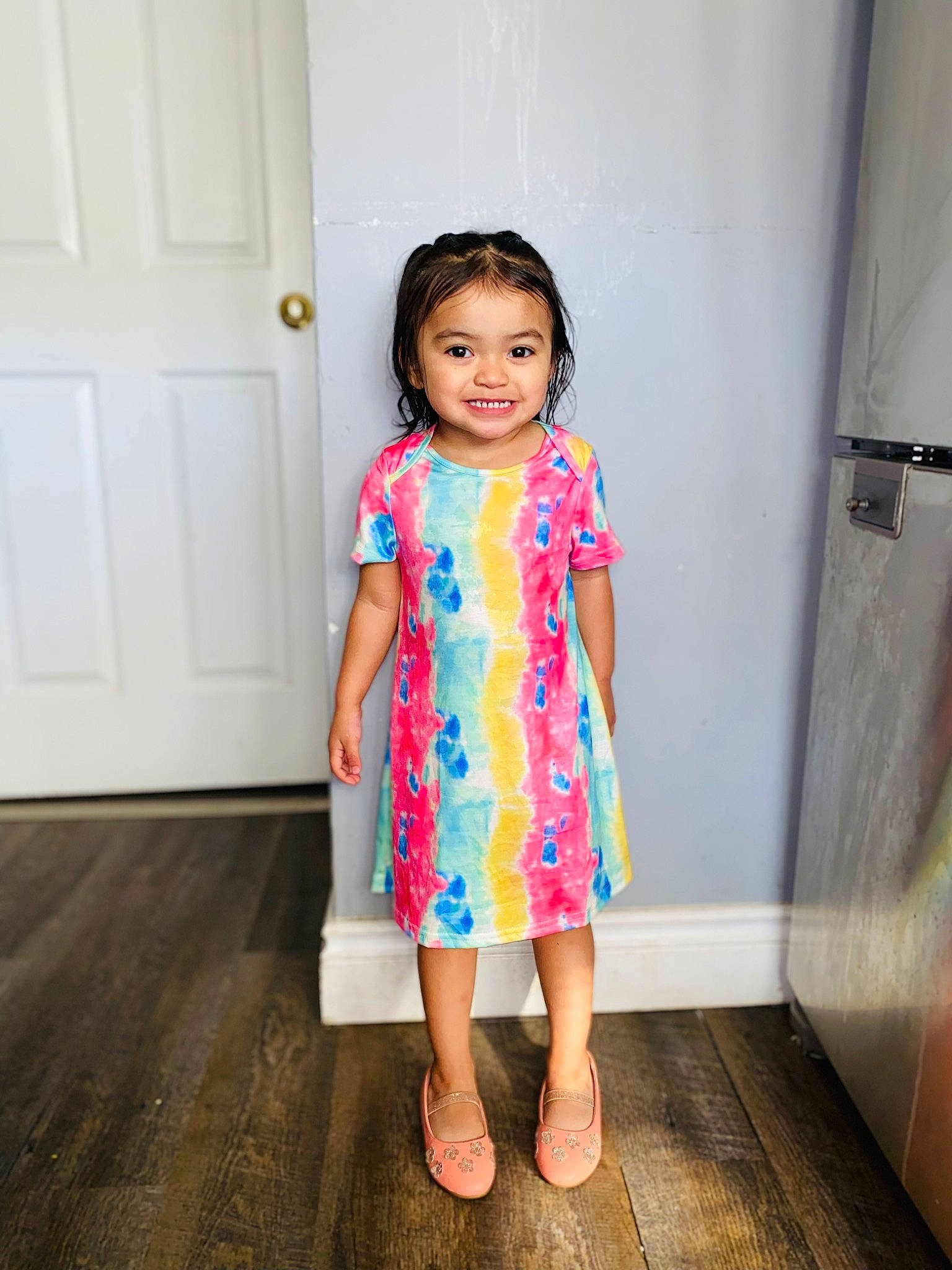Emani joined the competition — help win amazing prizes! baby_toddler_clothing, day_dress, door, dress, electric_blue, fashion_design, floor, flooring, happy, human_leg, joy, leg, magenta, one_piece_garment, person, sandal, shoe, shoulder, sleeve, toddler