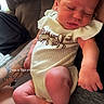 Harper is registered to the contest to win money with this photo: baby, infant, sleeping, person, couch, tattoo, clothing, foot, hand, skin, indoor, casual, comfort, rest, newborn, cute, human, relaxation, soft, small