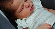 Harper joined the competition — help win amazing prizes! baby, sleeping, car_seat, white_clothing, infant, peaceful, child, young, portrait, close_up, seatbelt, head, face, soft_lighting, skin, hand, tiny, cute, newborn, resting
