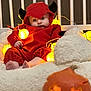 Malo participe au concours pour gagner de l'argent avec cette photo : baby, black, blanket, child, costume, cute, decor, devil, face, feet, festive, glowing, halloween, holiday, indoors, orange, pumpkin, soft, string_lights, toy