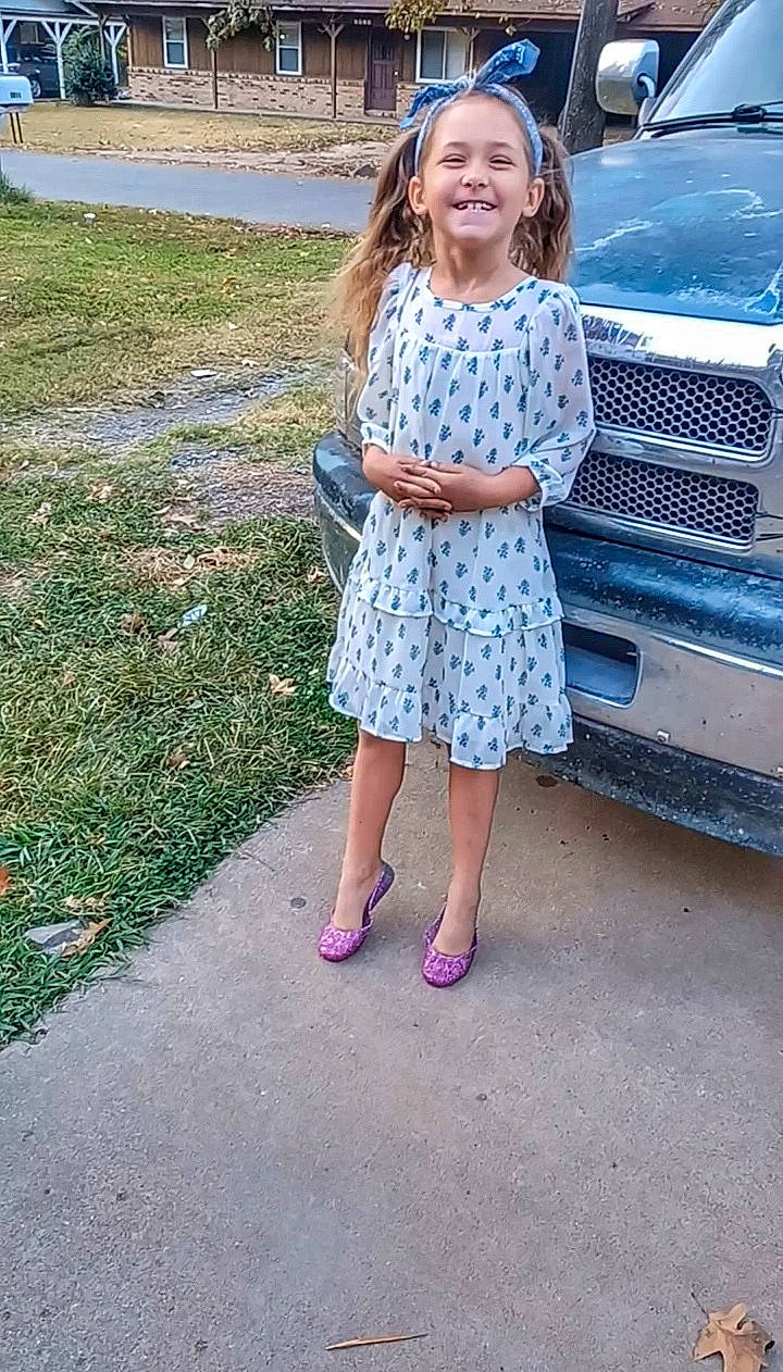 Adelyn joined the competition — help win amazing prizes! asphalt, automotive_design, automotive_exterior, automotive_lighting, automotive_tire, bumper, car, day_dress, dress, electric_blue, grass, hood, joy, leisure, motor_vehicle, person, plant, smile, tree, vehicle