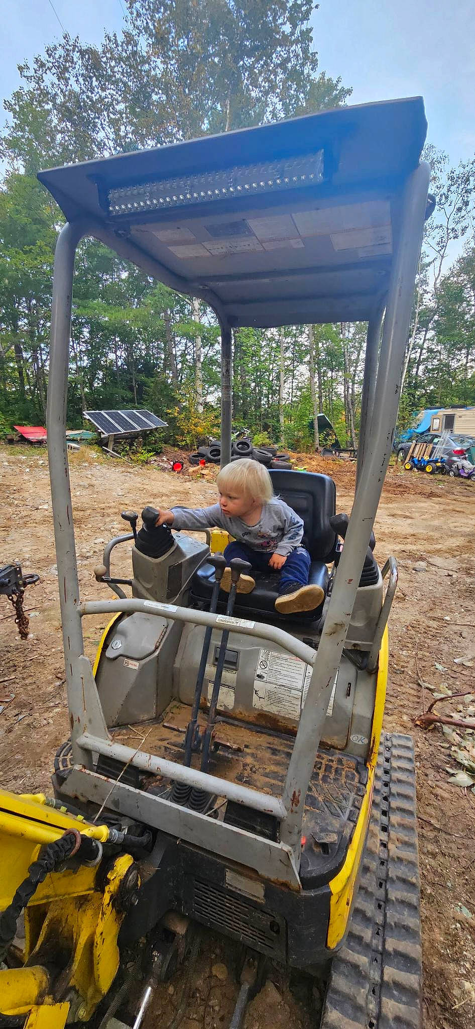 Bellamy is registered to the contest to win money with this photo: adventure, asphalt, auto_part, automotive_exterior, engineering, fun, leisure, machine, motor_vehicle, person, plant, public_transport, public_utility, recreation, sky, soil, track, tree, vehicle, wood