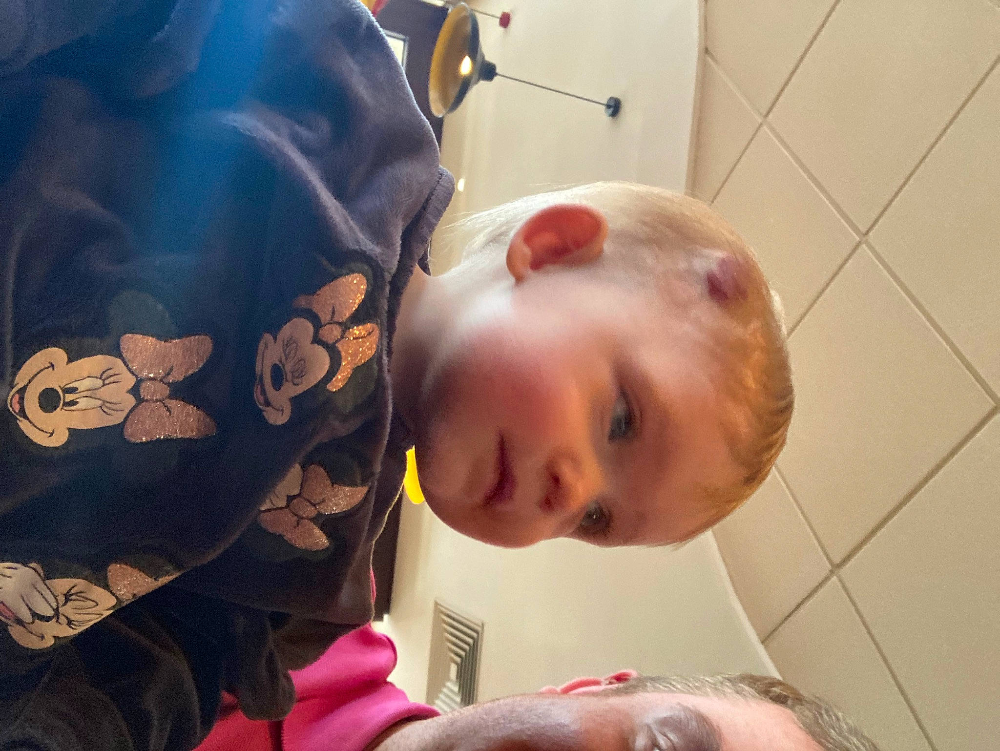 Lizzie is registered to the contest to win money with this photo: baby, baby_toddler_clothing, cheek, child, comfort, ear, eyelash, flooring, fun, happy, lip, mouth, neck, nose, person, personal_protective_equipment, room, sitting, sleeve, sunglasses