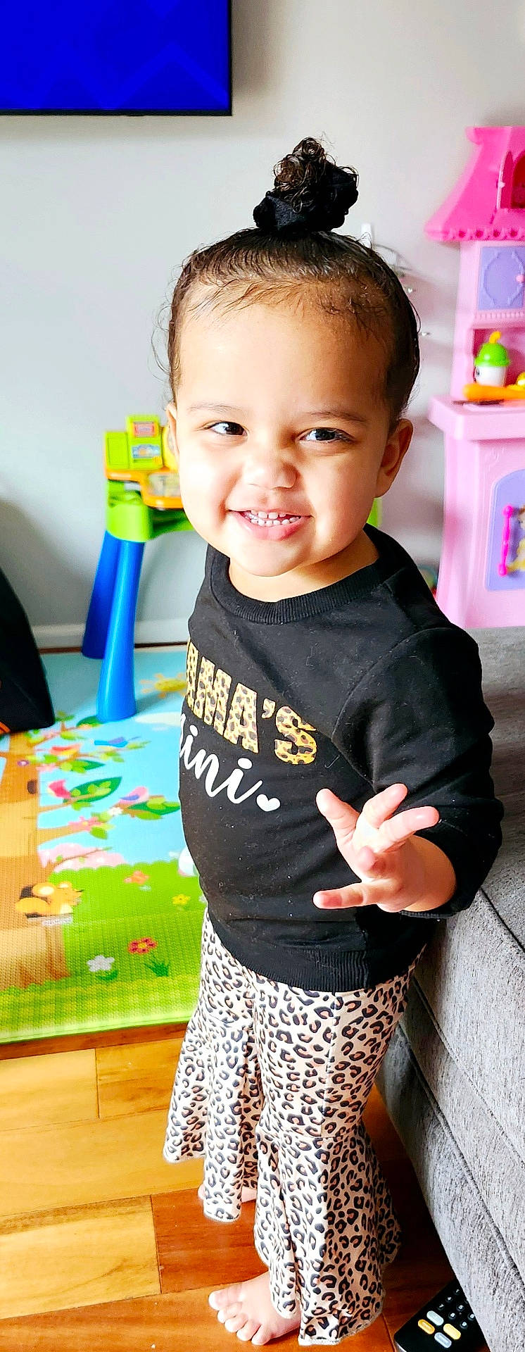 Kali is registered to the contest to win money with this photo: baby, bodypart, clothing, dress, face, finger, furniture, hand, happy, head, indoors, mouth, pants, person, photography, portrait, shorts, skirt, smile, t_shirt