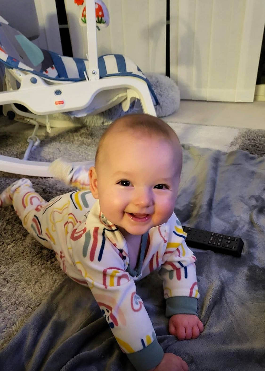 Sienna is registered to the contest to win money with this photo: aircraft, baby, baby_products, baby_toddler_clothing, baby_toys, carmine, chair, child, comfort, flooring, fun, happy, joy, person, play, room, sitting, smile, t_shirt, textile