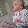 Eleanor joined the competition — help win amazing prizes! baby, blanket, child, childhood, couch, cozy, cute, furniture, home, indoor, pajamas, penguin, person, portrait, seated, side_view, snowman, soft_fabric, thoughtful, winter